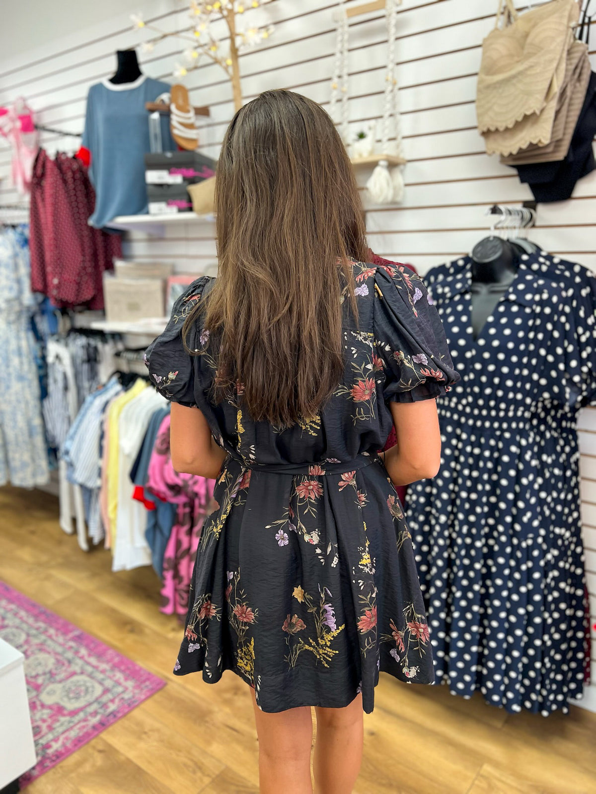 Entro black floral puff sleeve mini dress with tie waist, back view