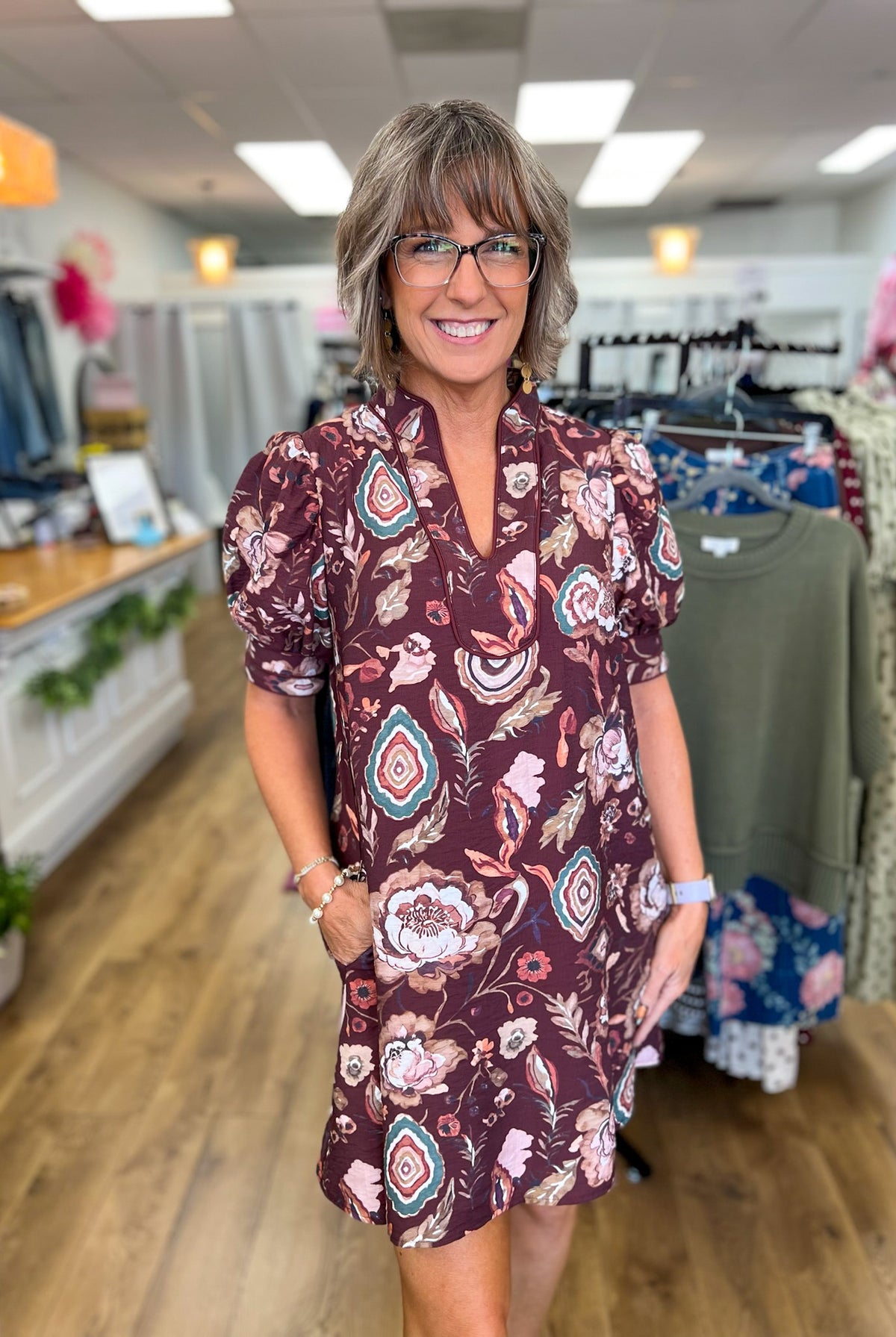Wine floral V-neck dress with short puff sleeves and pockets by Entro