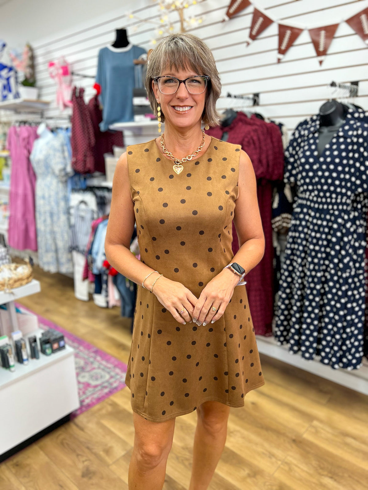 Cappuccino brown sleeveless polka dot suede mini dress with A-line silhouette