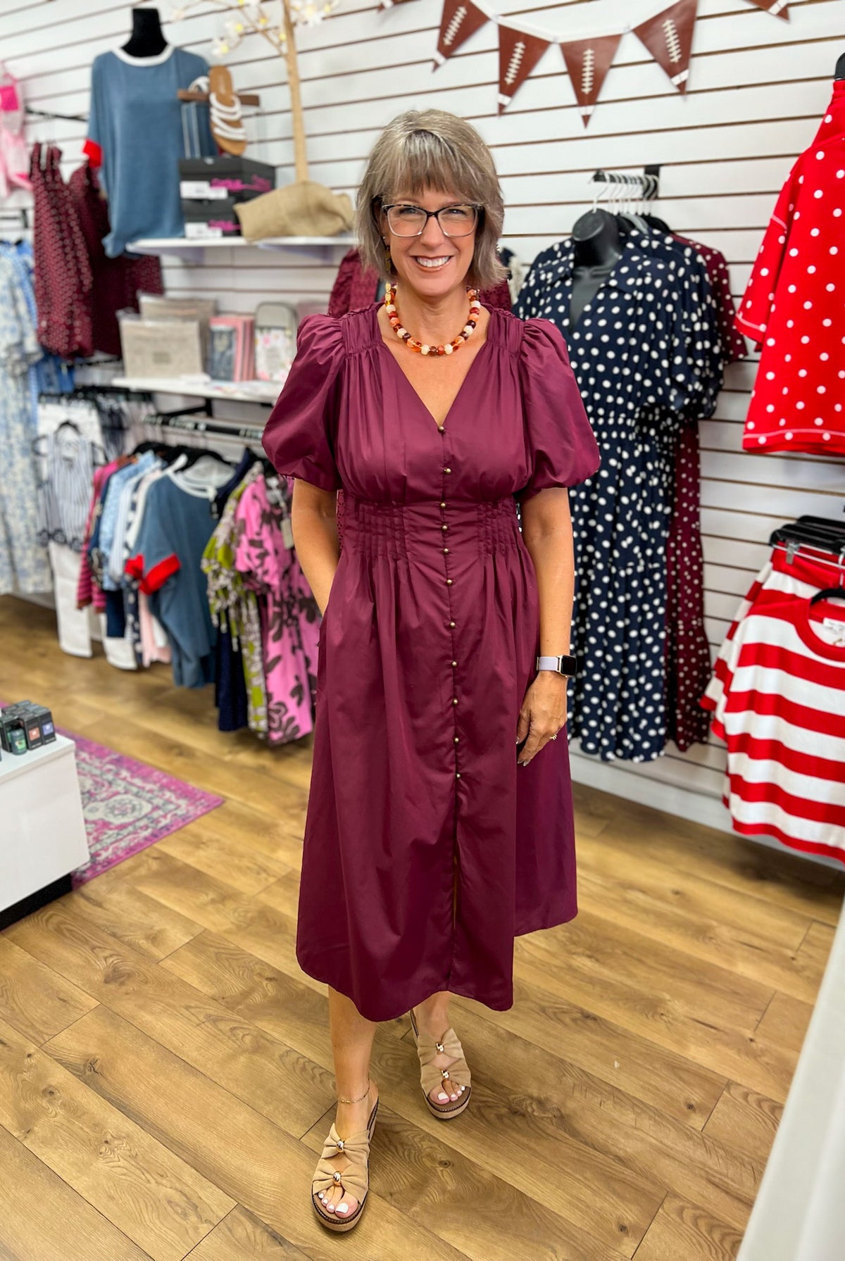 Wine midi dress with puff sleeves, gold buttons, smocked waist, and pockets
