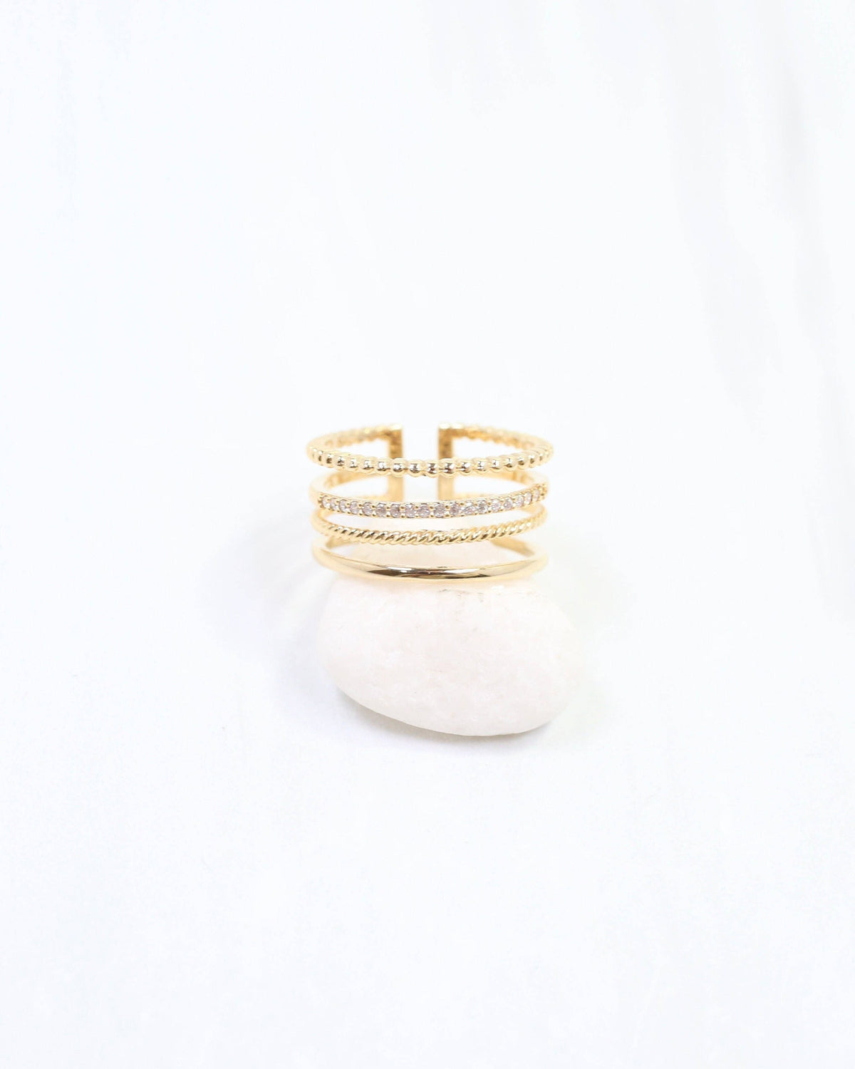 Gold four-row adjustable ring with beaded, rope, crystal pavé, and plain bands
