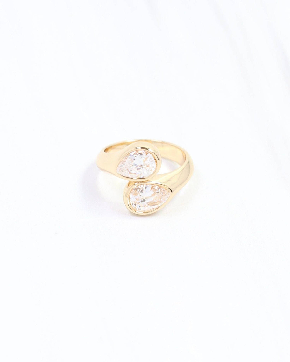 Gold-tone adjustable ring with two bezel-set pear-shaped clear cubic zirconia stones