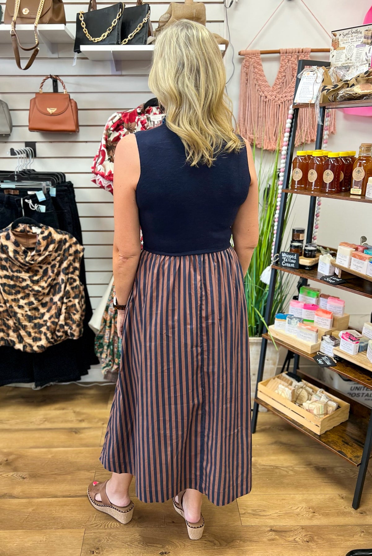Navy sleeveless mock neck midi dress with brown navy vertical striped skirt