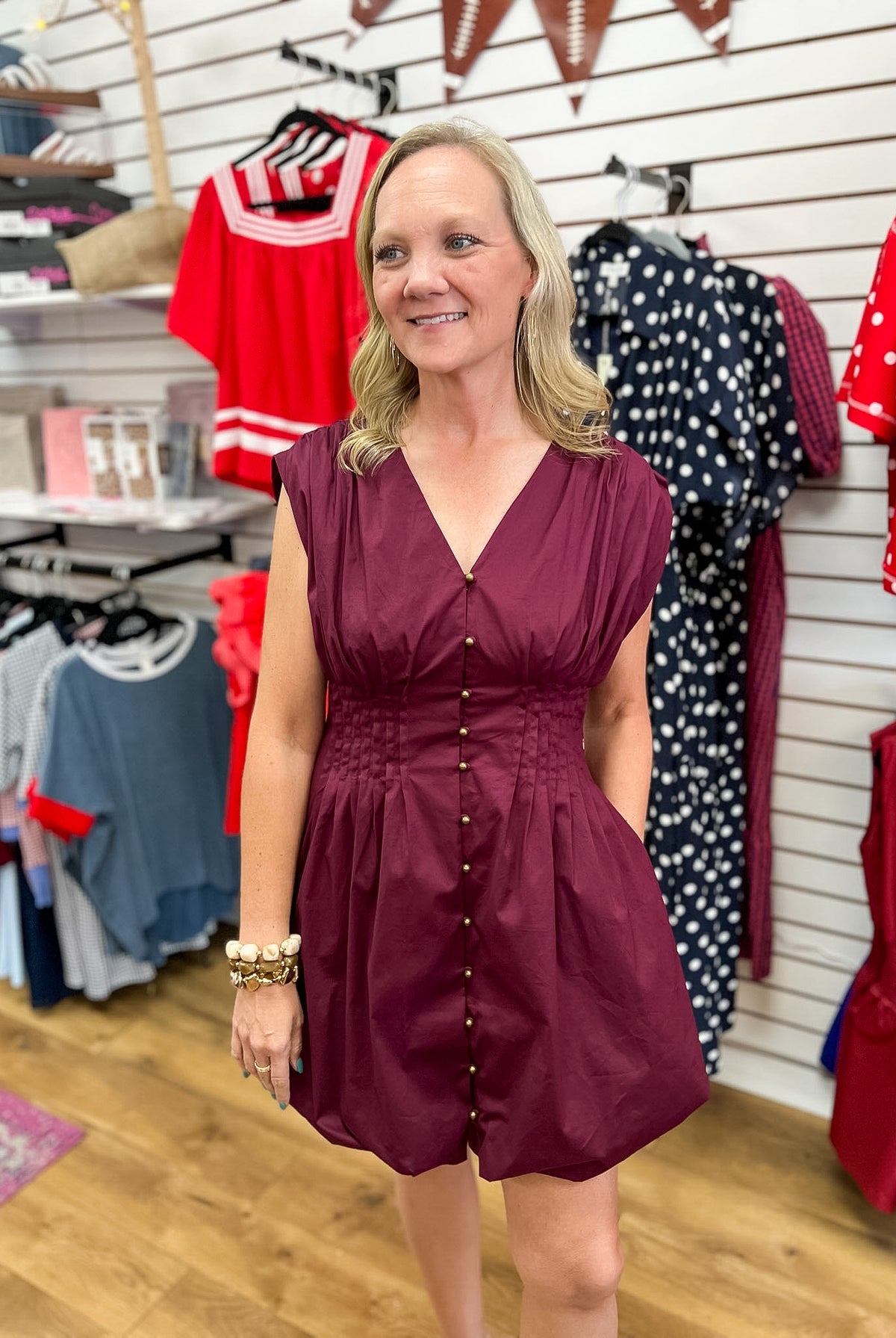 Merlot sleeveless mini dress with pintuck waist and gold button front by Entro