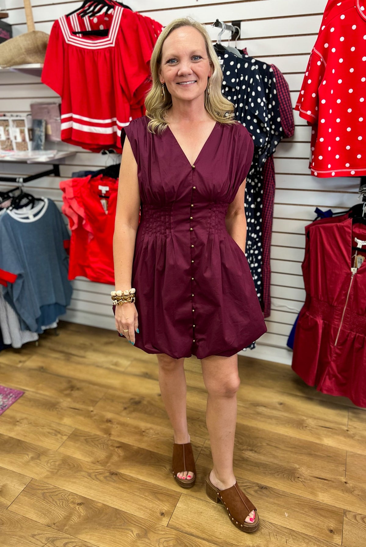 Merlot sleeveless bubble dress with pintuck waist and gold button front