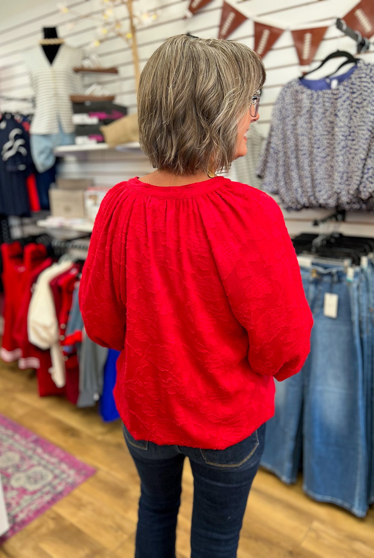 Cherry red jacquard top with gathered neckline and 3/4 balloon sleeves, back view