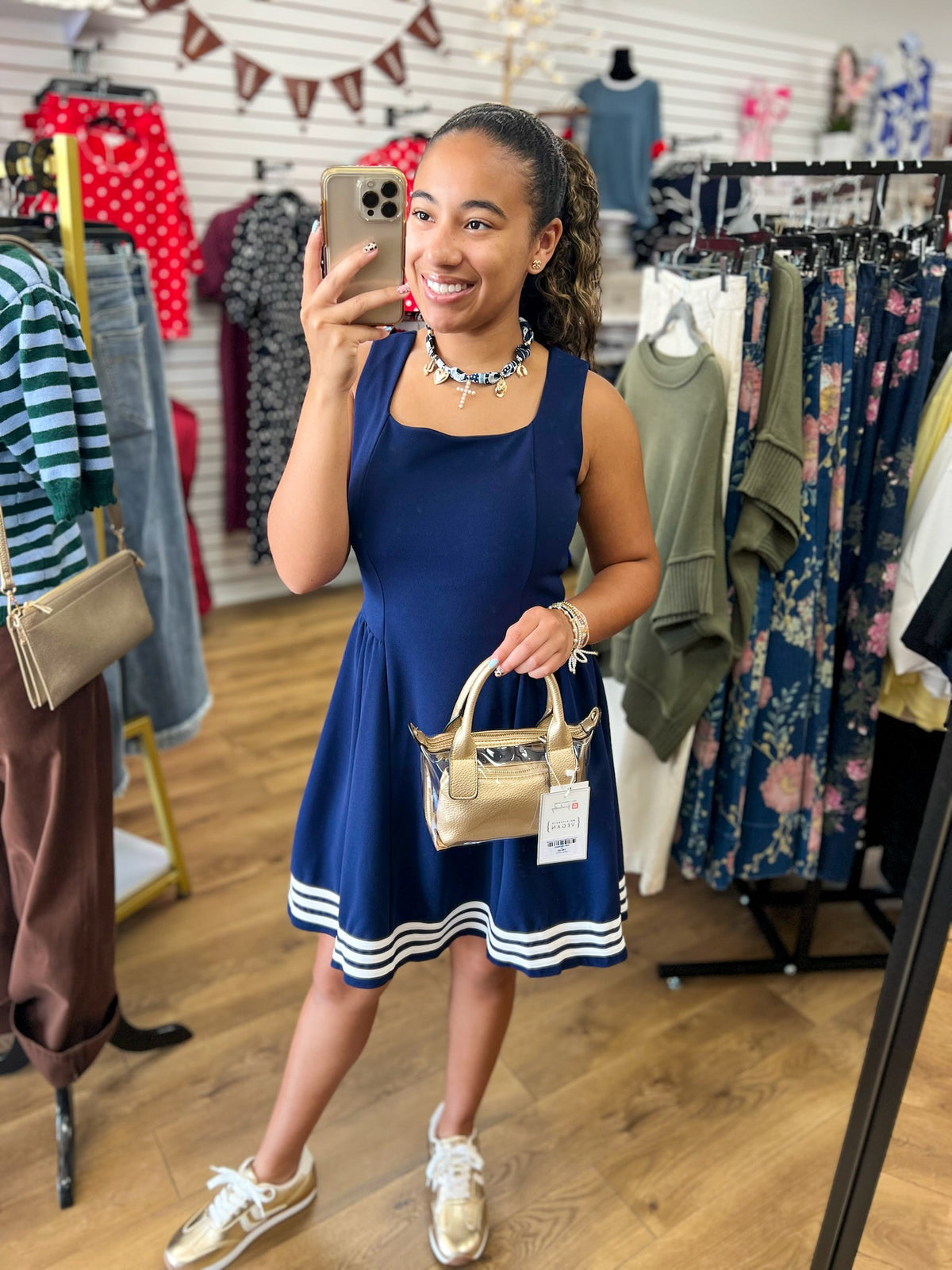 Navy blue sleeveless dress with square neckline and white contrast stripe hem