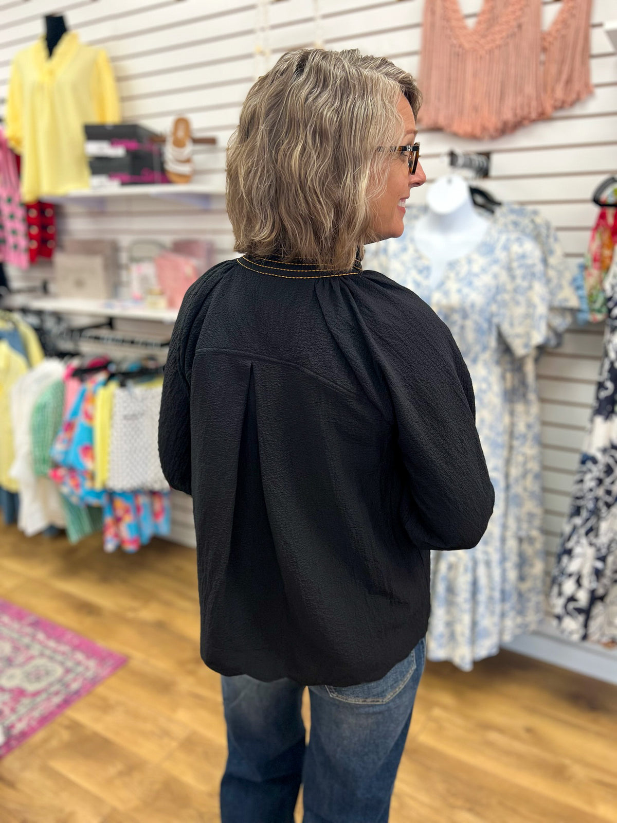 Black textured V-neck blouse with 3/4 balloon sleeves, back view, by Umgee