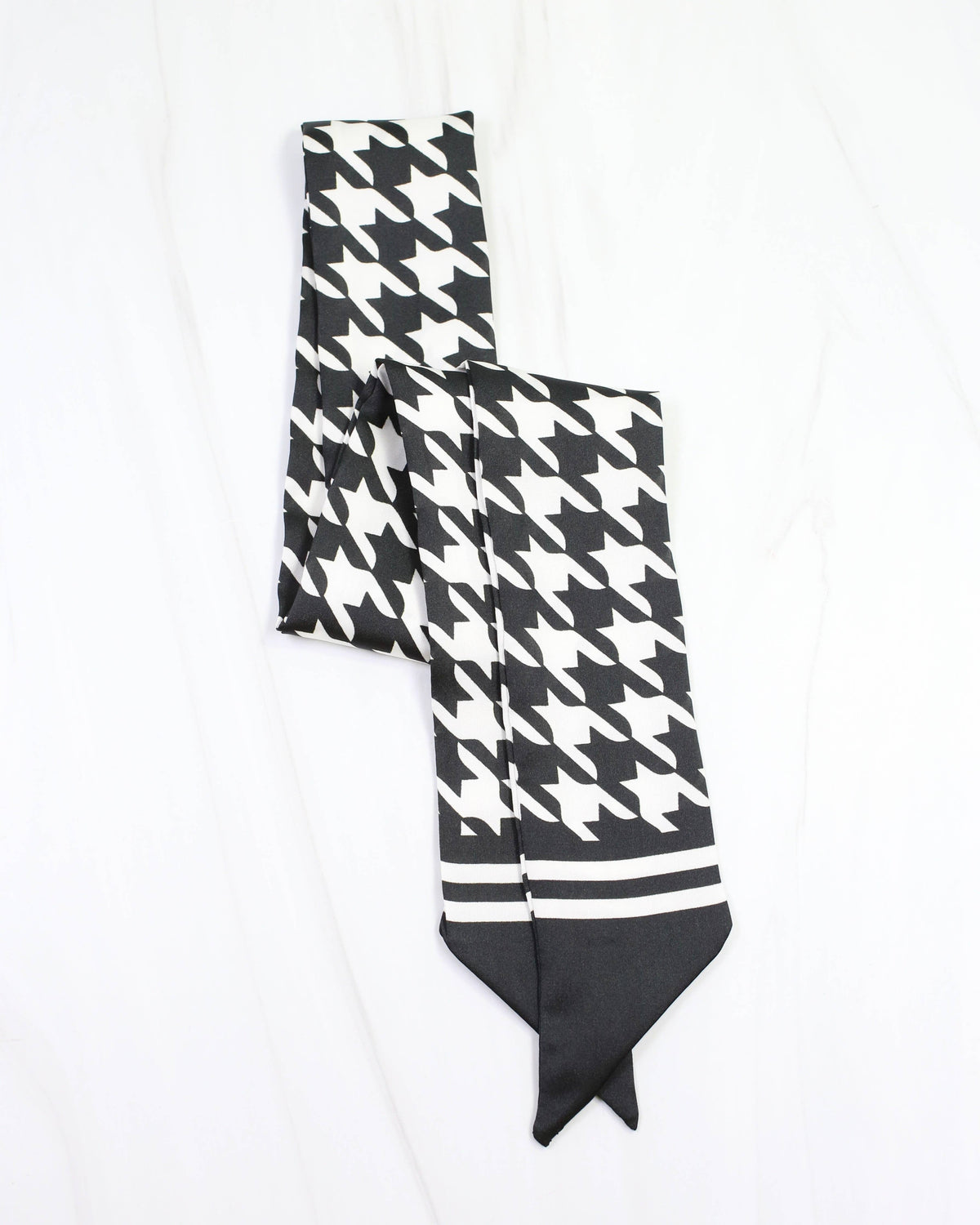 Black and white houndstooth skinny scarf with solid black pointed ends
