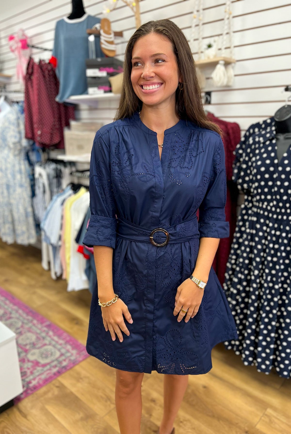 Navy eyelet embroidered mini dress with O-ring belt and 3/4 roll-up sleeves