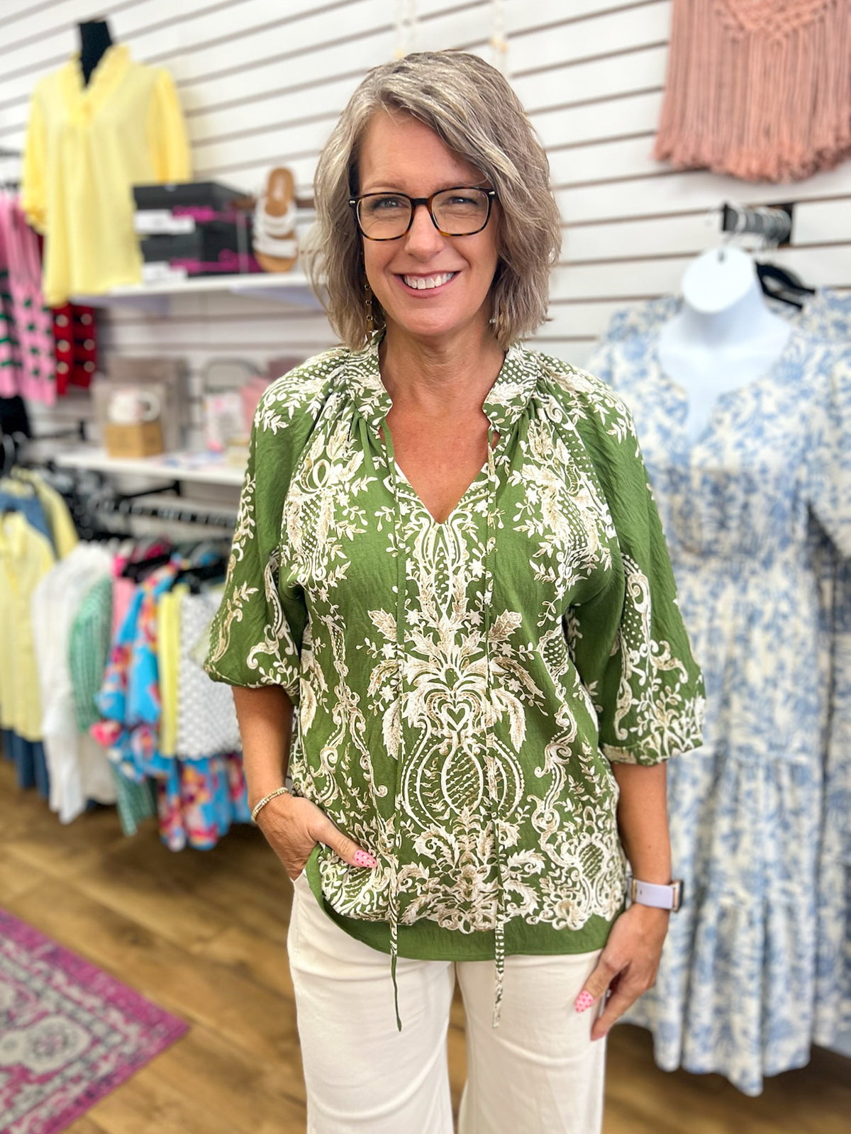 Olive green boho border print blouse with balloon sleeves and tassel v-neckline