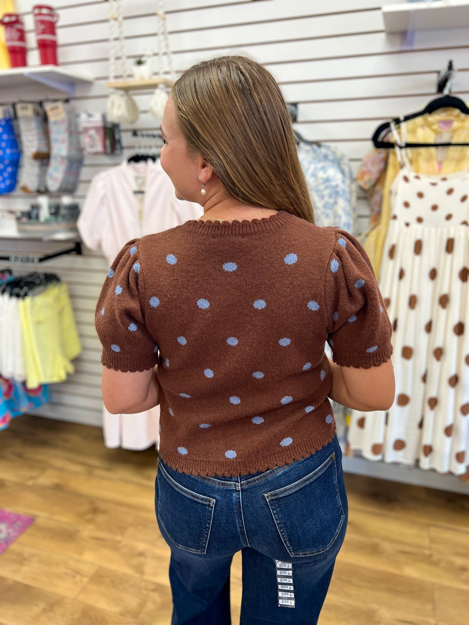 Brown short sleeve sweater with blue polka dots and scalloped trim details