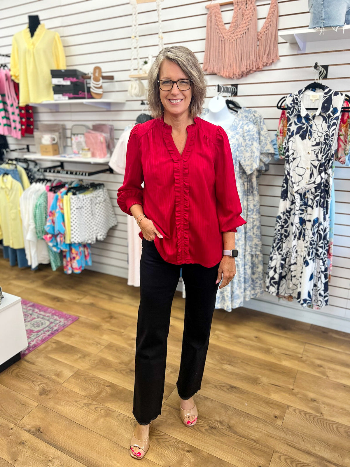 Crimson red ruffle trim V-neck blouse with long balloon sleeves on model