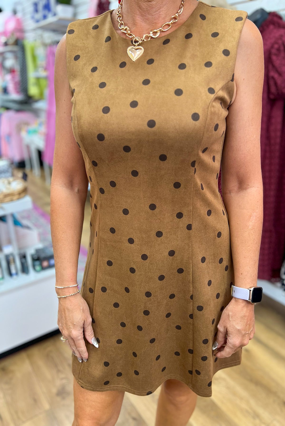 Tan sleeveless suede mini dress with dark brown polka dots and crew neckline