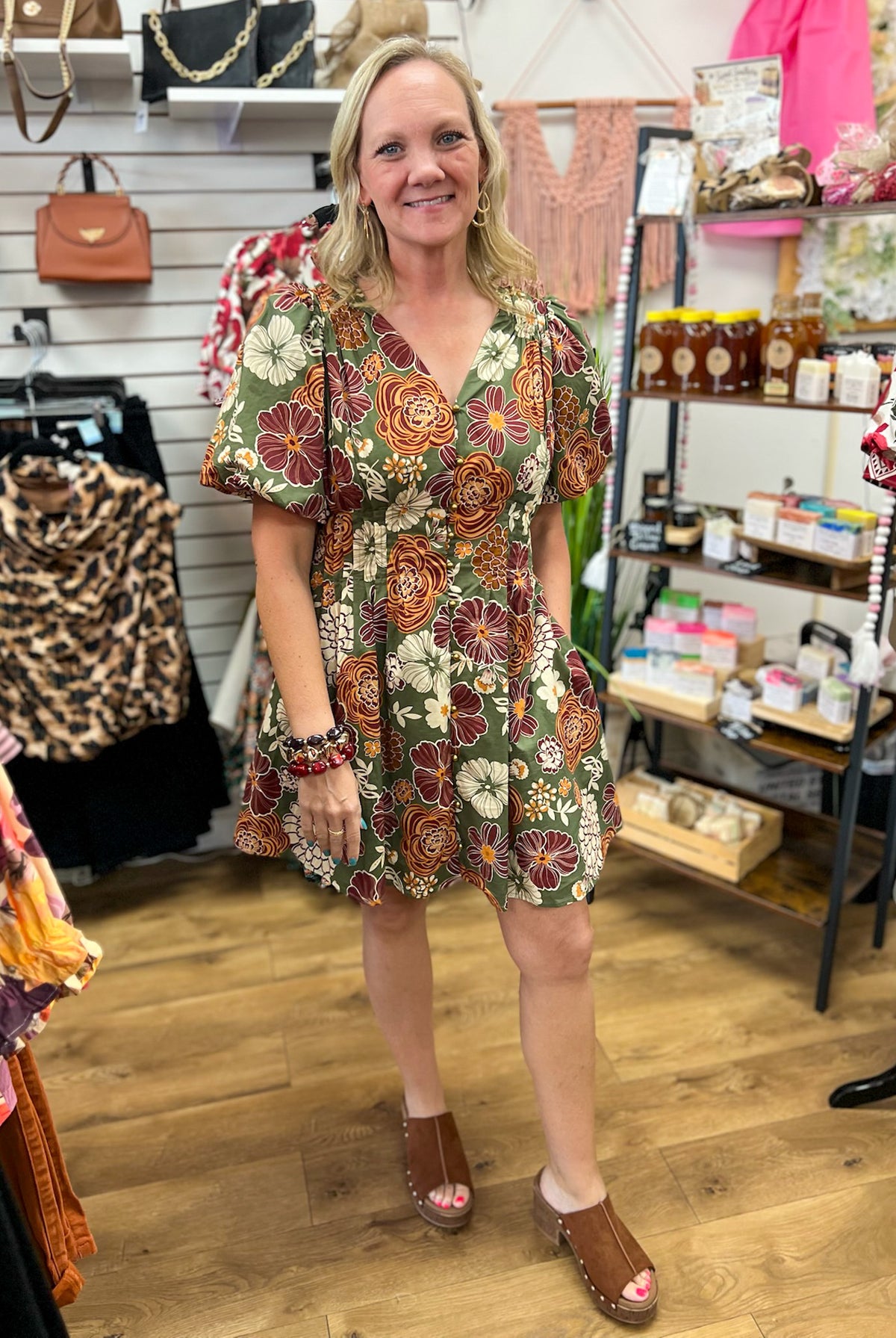 Olive green floral mini dress with rust burgundy blooms and short puff sleeves