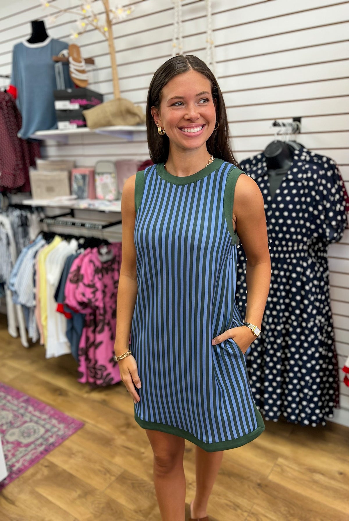 Hunter green and blue vertical stripe sleeveless mini dress with contrast trim and pockets