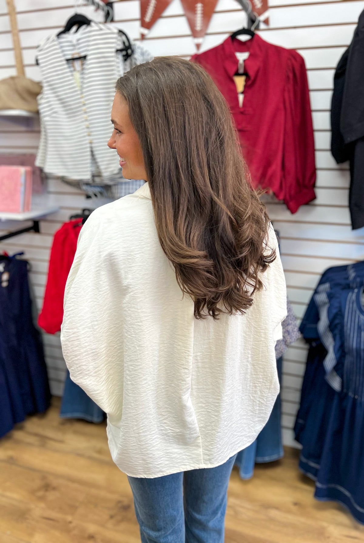 Ecru textured button down top with short dolman sleeves, back view