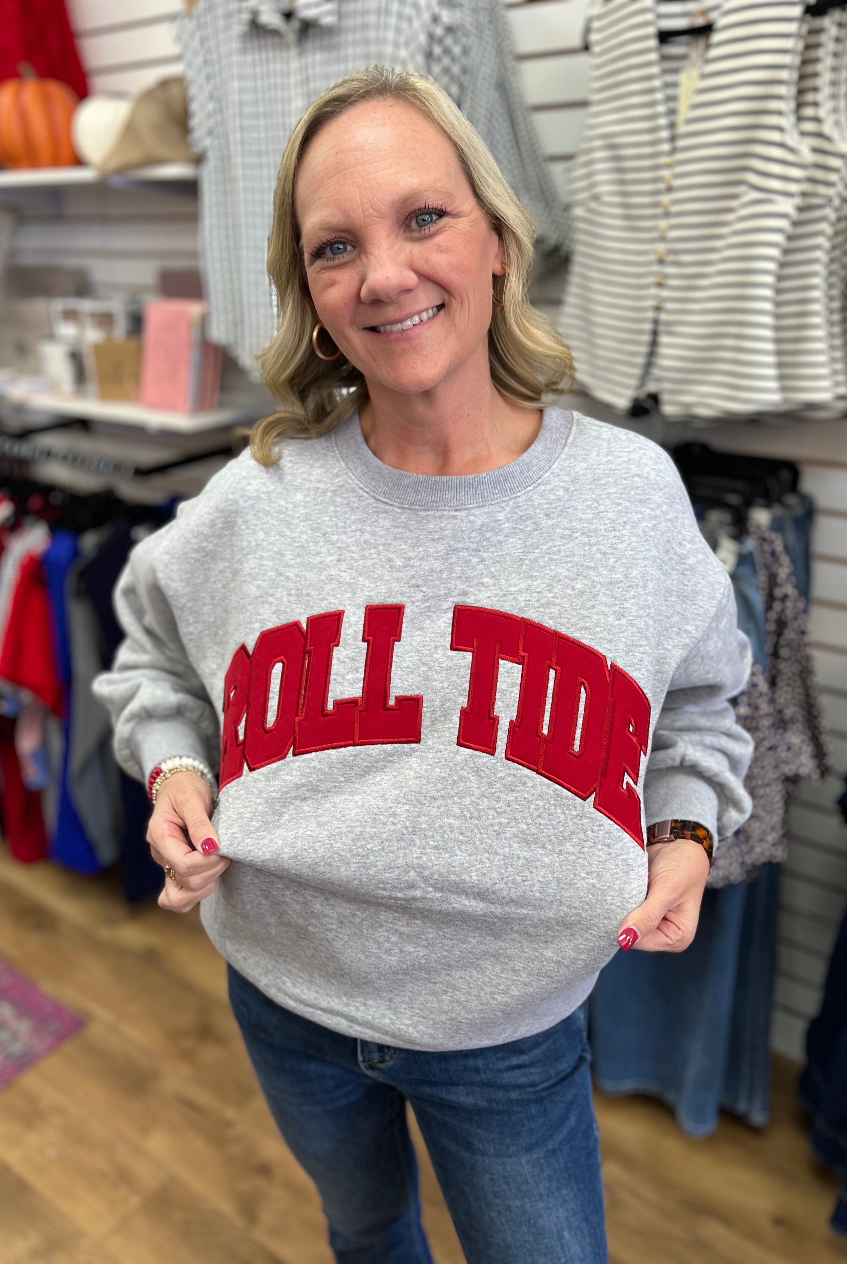 Grey crewneck sweatshirt with bold red arched Roll Tide lettering