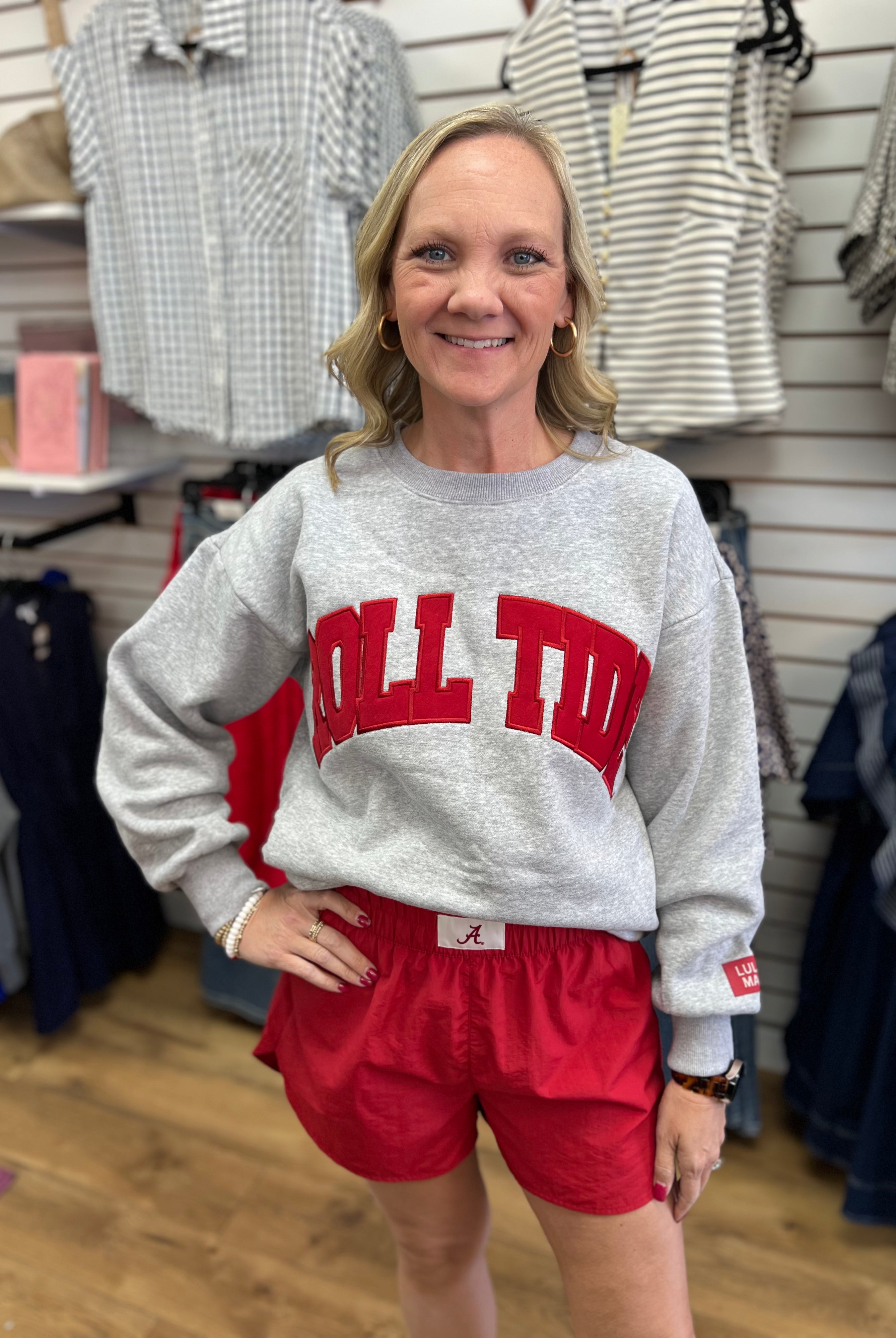 Grey Roll Tide crewneck sweatshirt with red embroidered letters, paired with red shorts