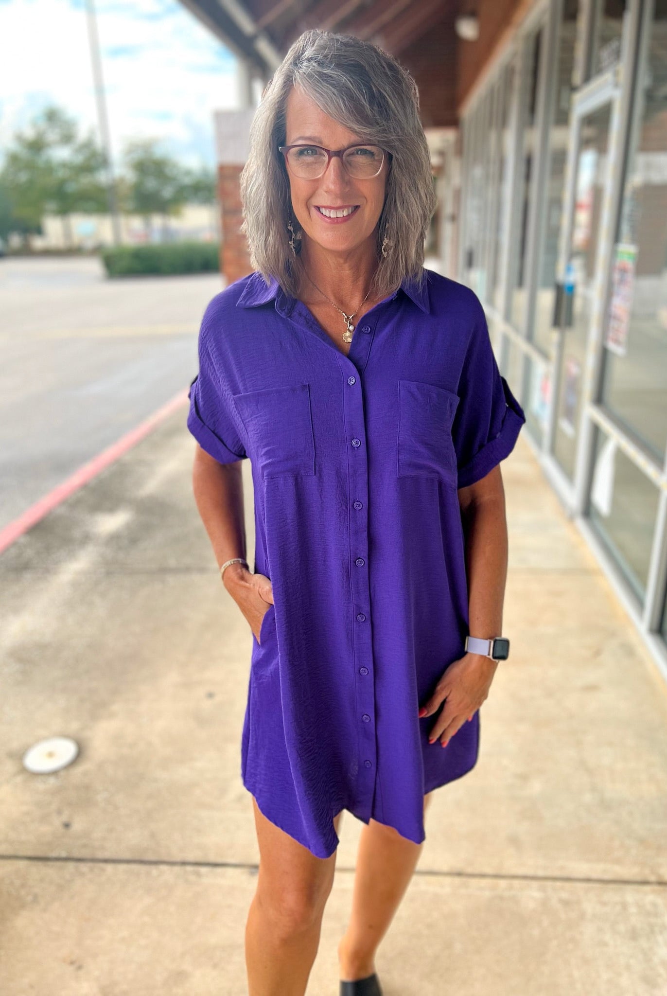 Purple button down shirt dress, collared, rolled tab short sleeves with drop shoulders. Pockets. Game day wear Louisiana, Michigan - A'Bekah's Boutique