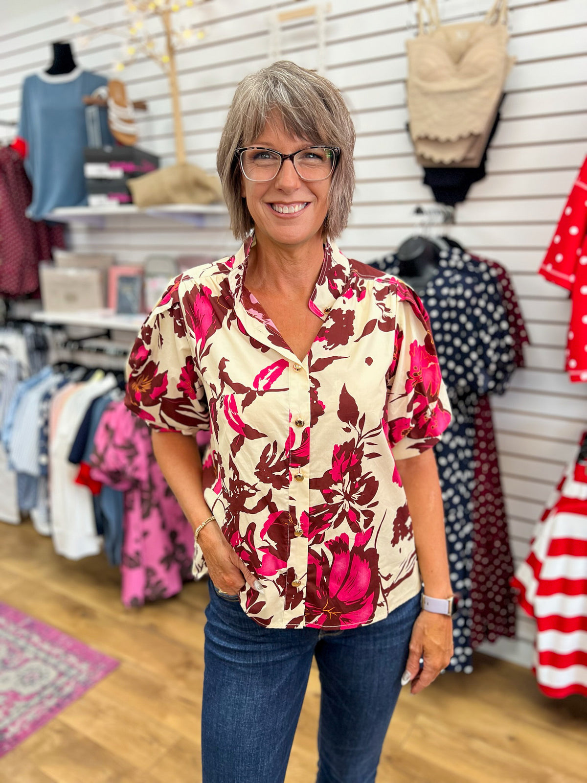 Entro wine and pink floral button-up top with short puff sleeves on model