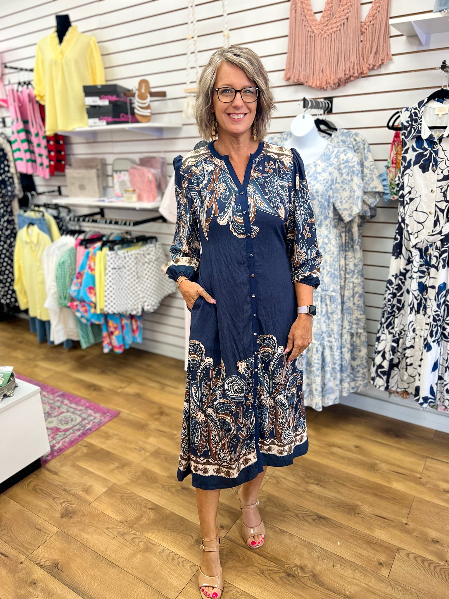 Navy blue paisley print button-front midi dress with 3/4 sleeves and border hem