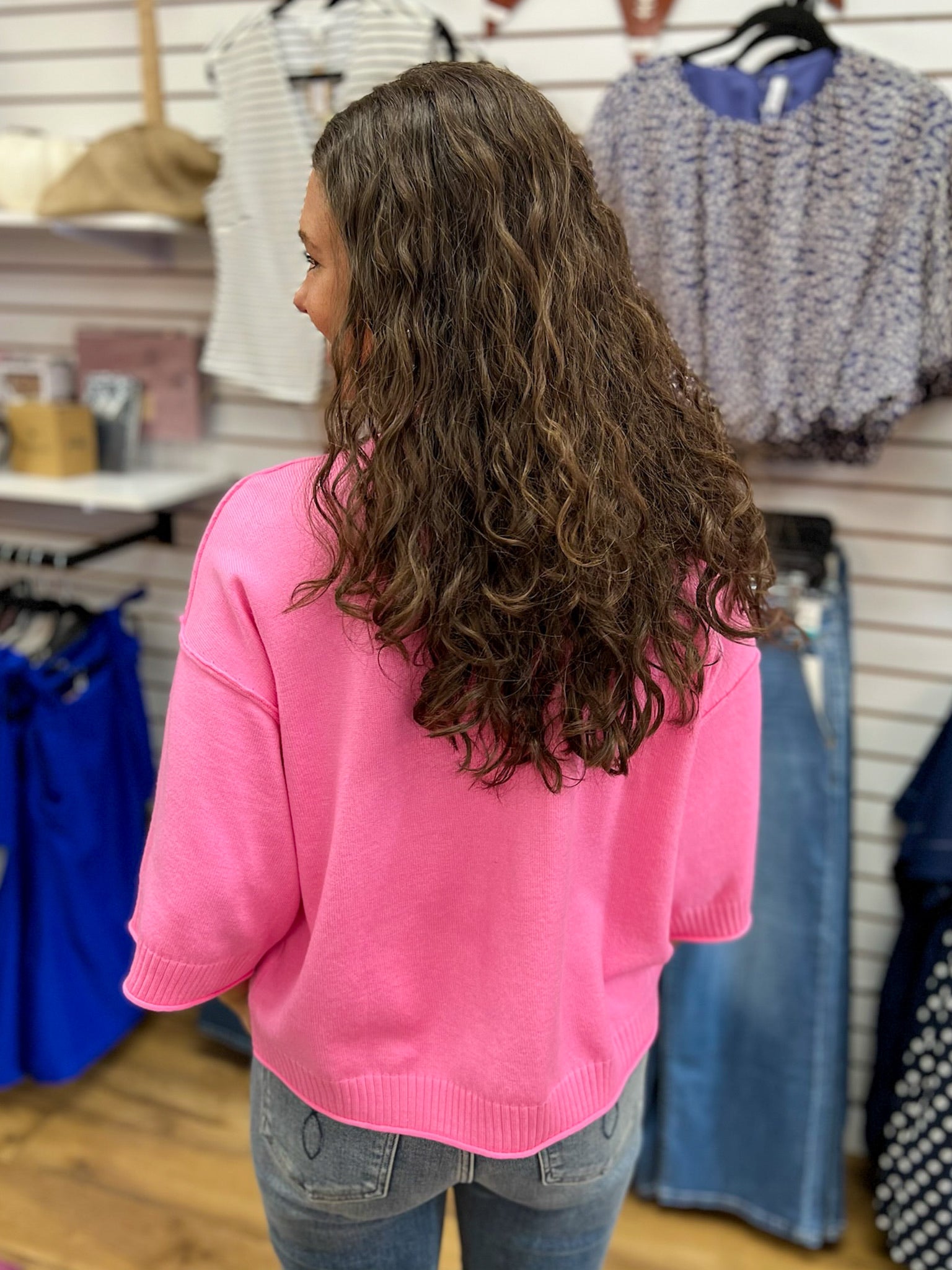 Glam pink mock neck sweater with 3/4 sleeves, ribbed hem, back view