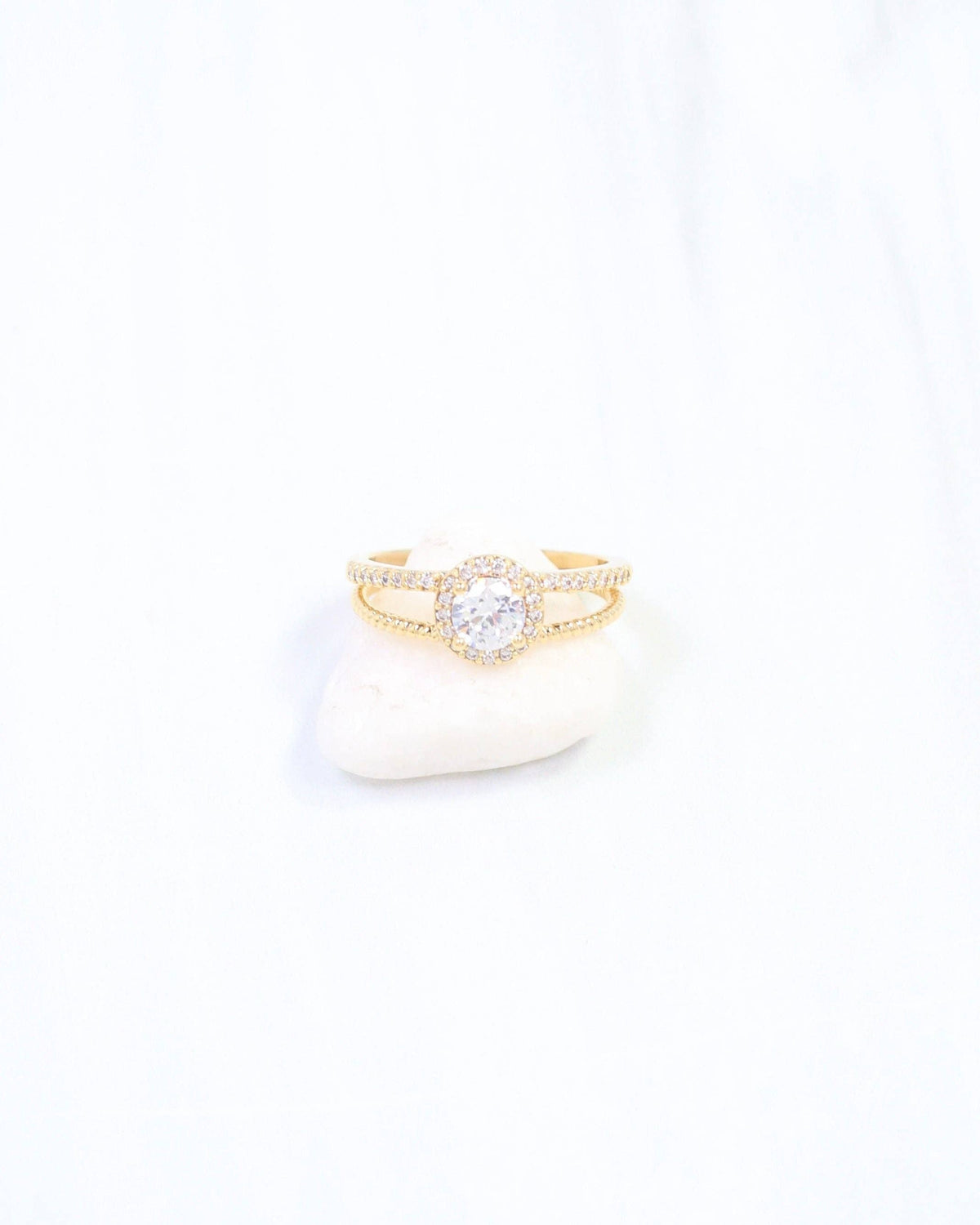 Gold halo CZ ring with round center stone and split shank band