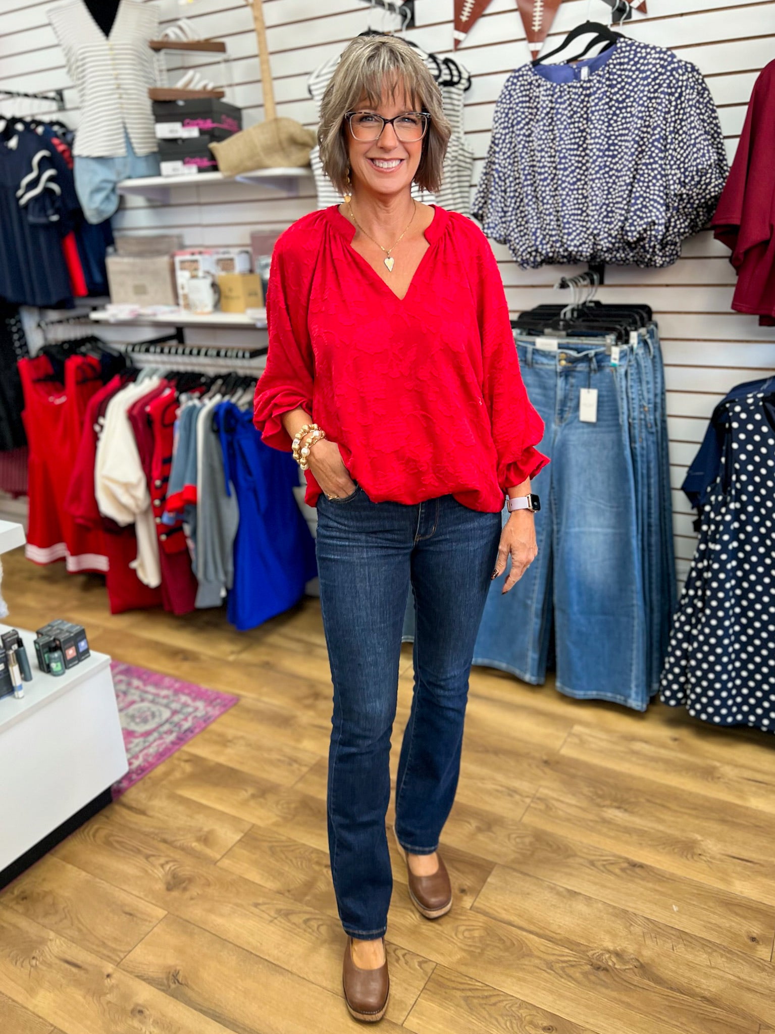 Cherry red jacquard blouse with V-neck and 3/4 balloon sleeves on model