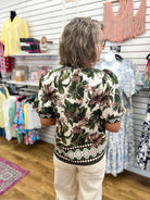 Entro olive floral top with short puff sleeves and geometric border trim