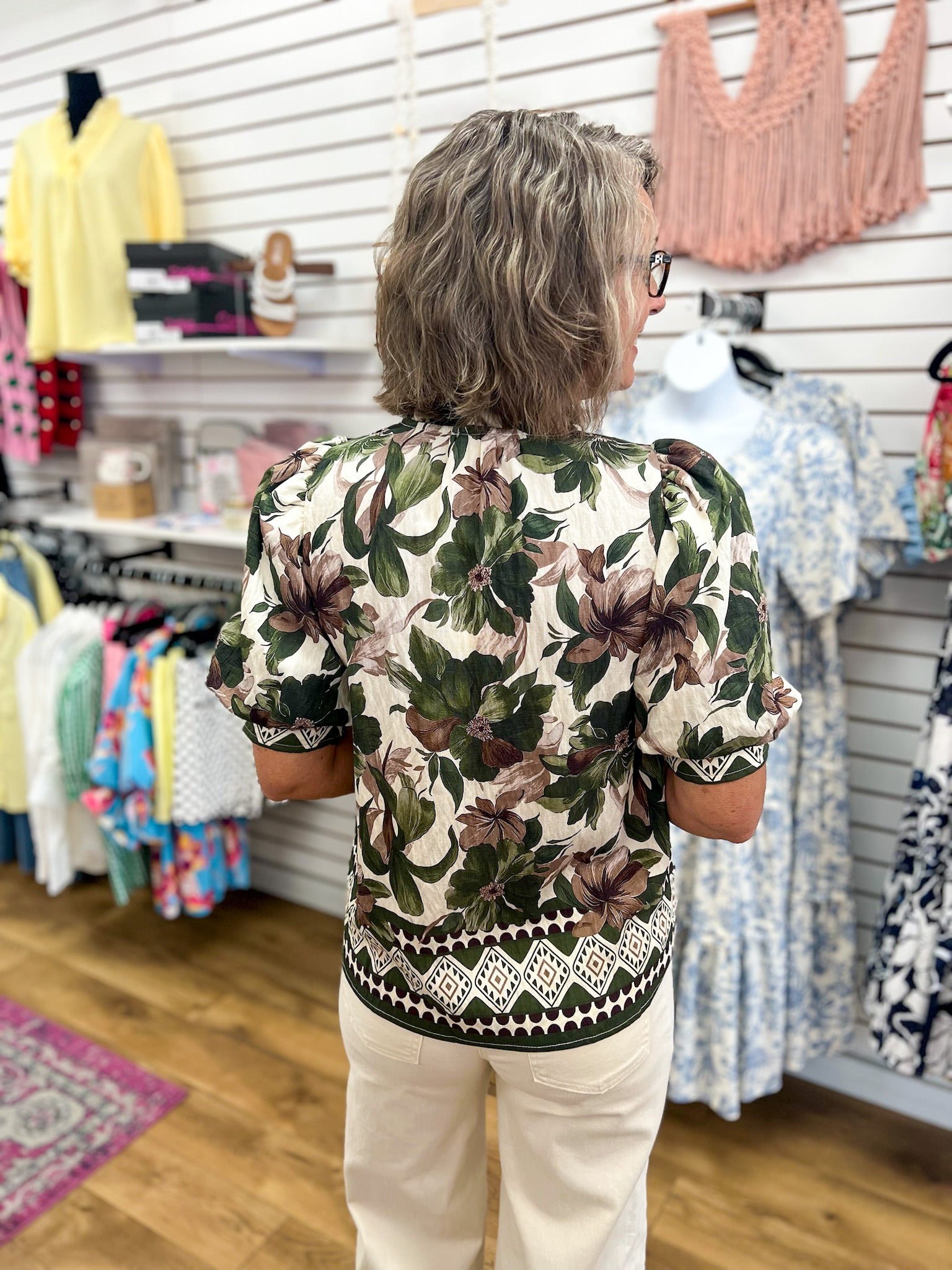Entro olive floral top with short puff sleeves and geometric border trim