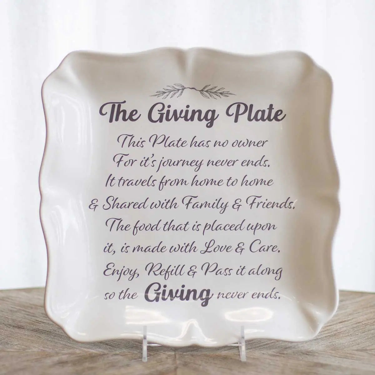 White square ceramic platter with scalloped edges and The Giving Plate sentiment text