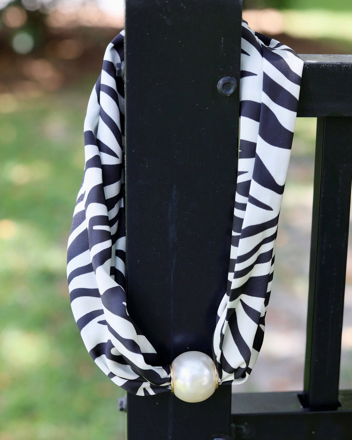 Black and white zebra print infinity scarf necklace with large magnetic pearl closure