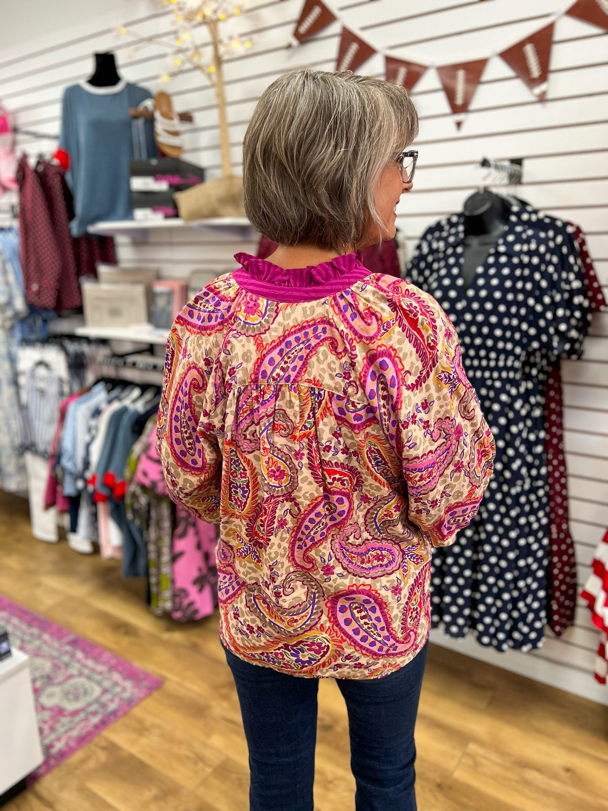 Ecru paisley print blouse with magenta ruffle neck and 3/4 balloon sleeves
