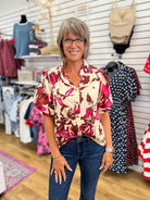 Entro wine floral button-up top with short puff sleeves on model with jeans