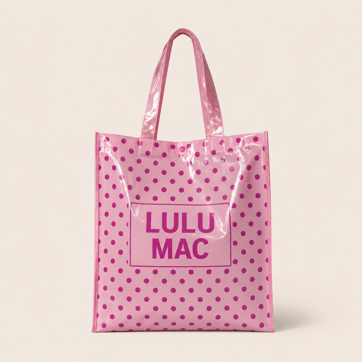 Light pink glossy tote bag with hot pink polka dots and Lulu Mac logo