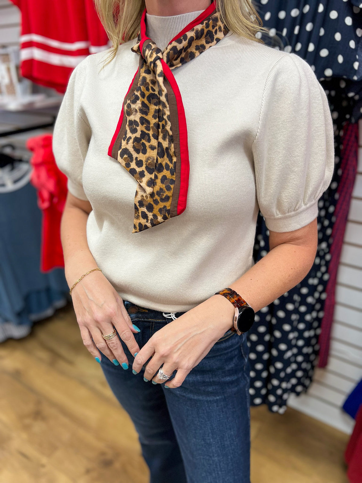 Ecru puff sleeve knit top with leopard print red trim neck scarf by Entro