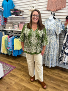 Olive green boho border print top with 3/4 balloon sleeves and cream pattern