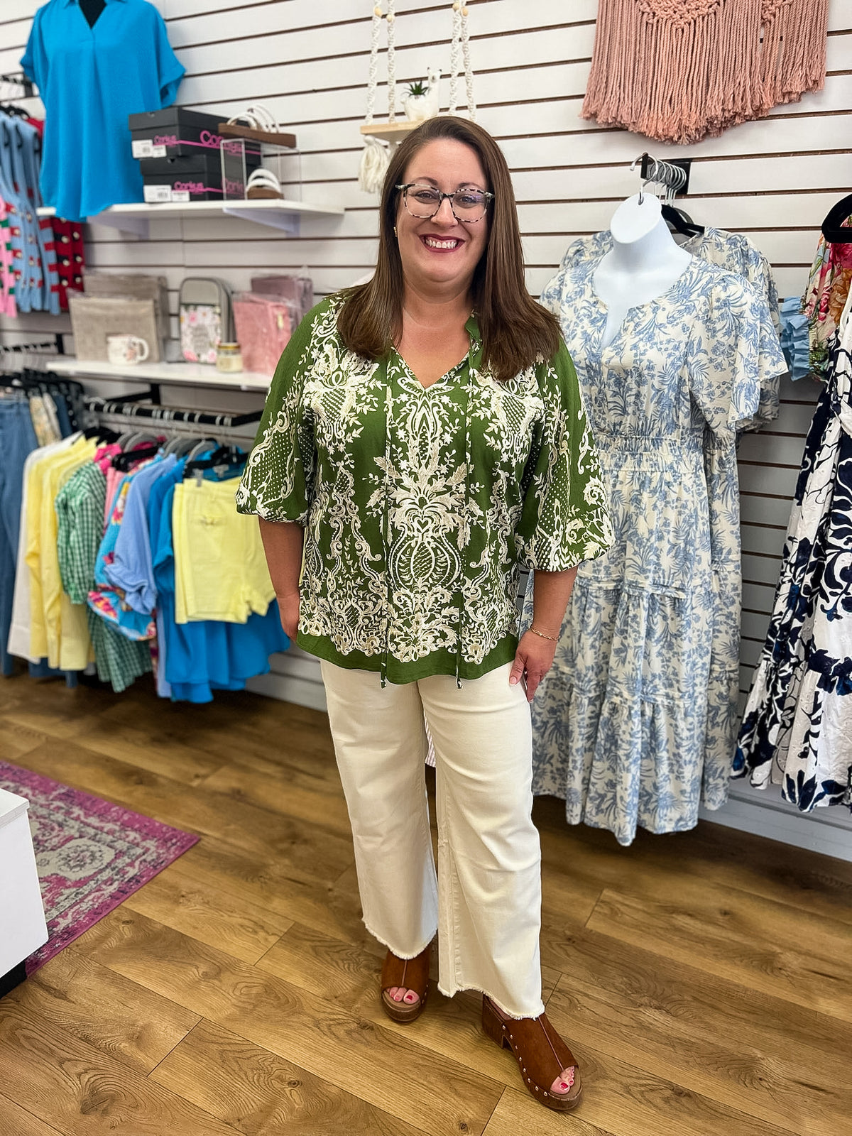 Olive green boho border print top with 3/4 balloon sleeves and cream pattern