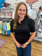 Black short sleeve ruffle neck knit sweater top with gold front buttons