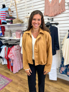 Camel faux suede zip-up bubble hem jacket worn over white top with black pants