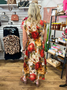 Entro cream midi dress with bold red and gold floral print, sleeveless, midi length