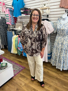 Brown paisley print 3/4 sleeve top with self-tie neckline by Umgee