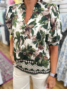 Entro olive floral short puff sleeve blouse with geometric border hem