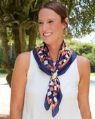 Navy and orange geometric print silk scarf with gold football ring clasp