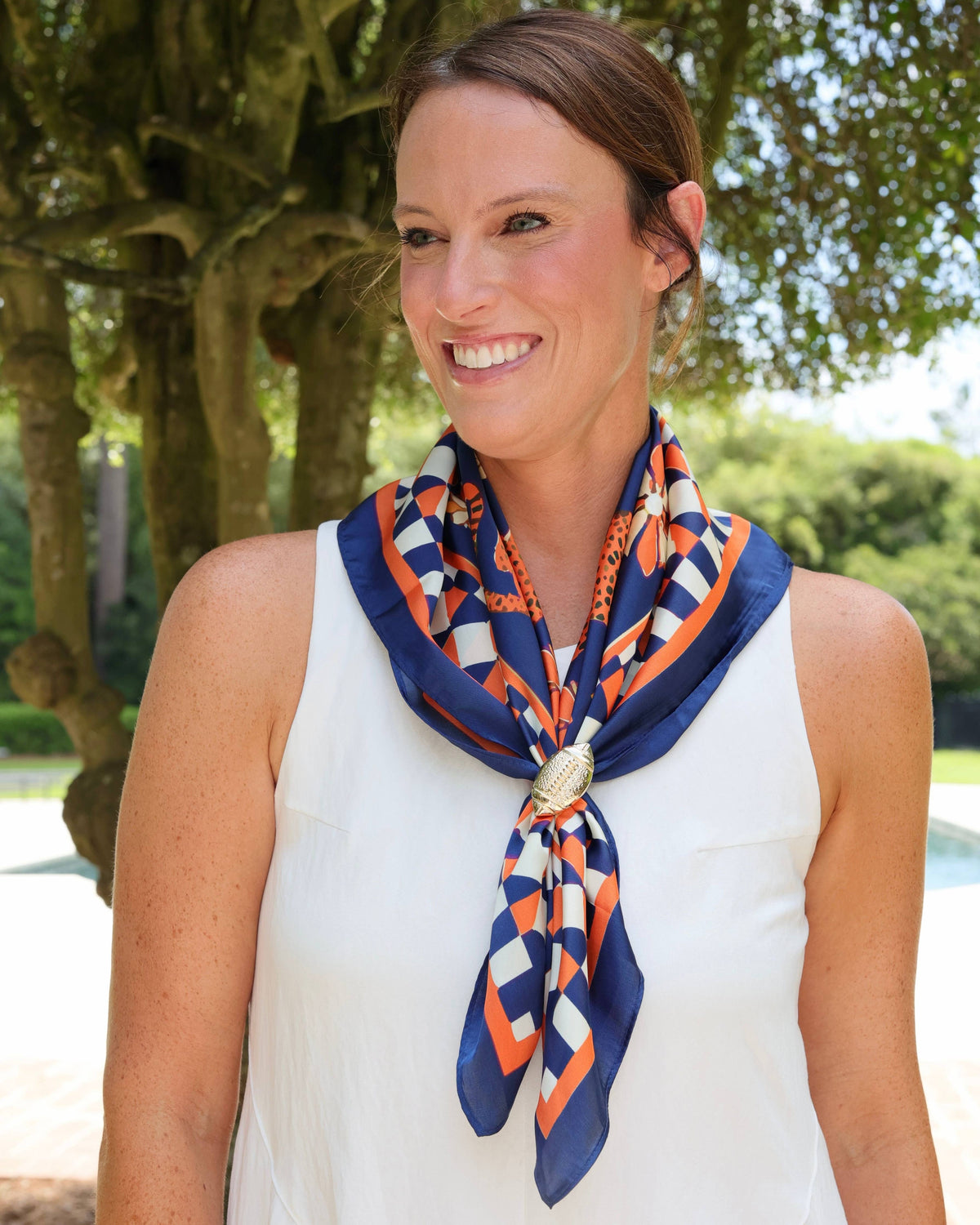 Navy and orange geometric print silk scarf with gold football ring clasp