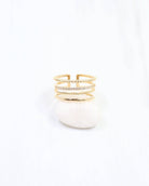Gold four-row adjustable ring with beaded, rope, crystal pavé, and plain bands
