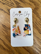 Clay drop earrings shaped like Alabama state in navy, orange, gold, and white swirl pattern