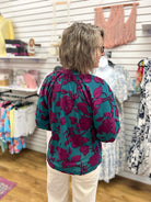Umgee teal floral blouse with magenta blooms, 3/4 balloon sleeves, white pants