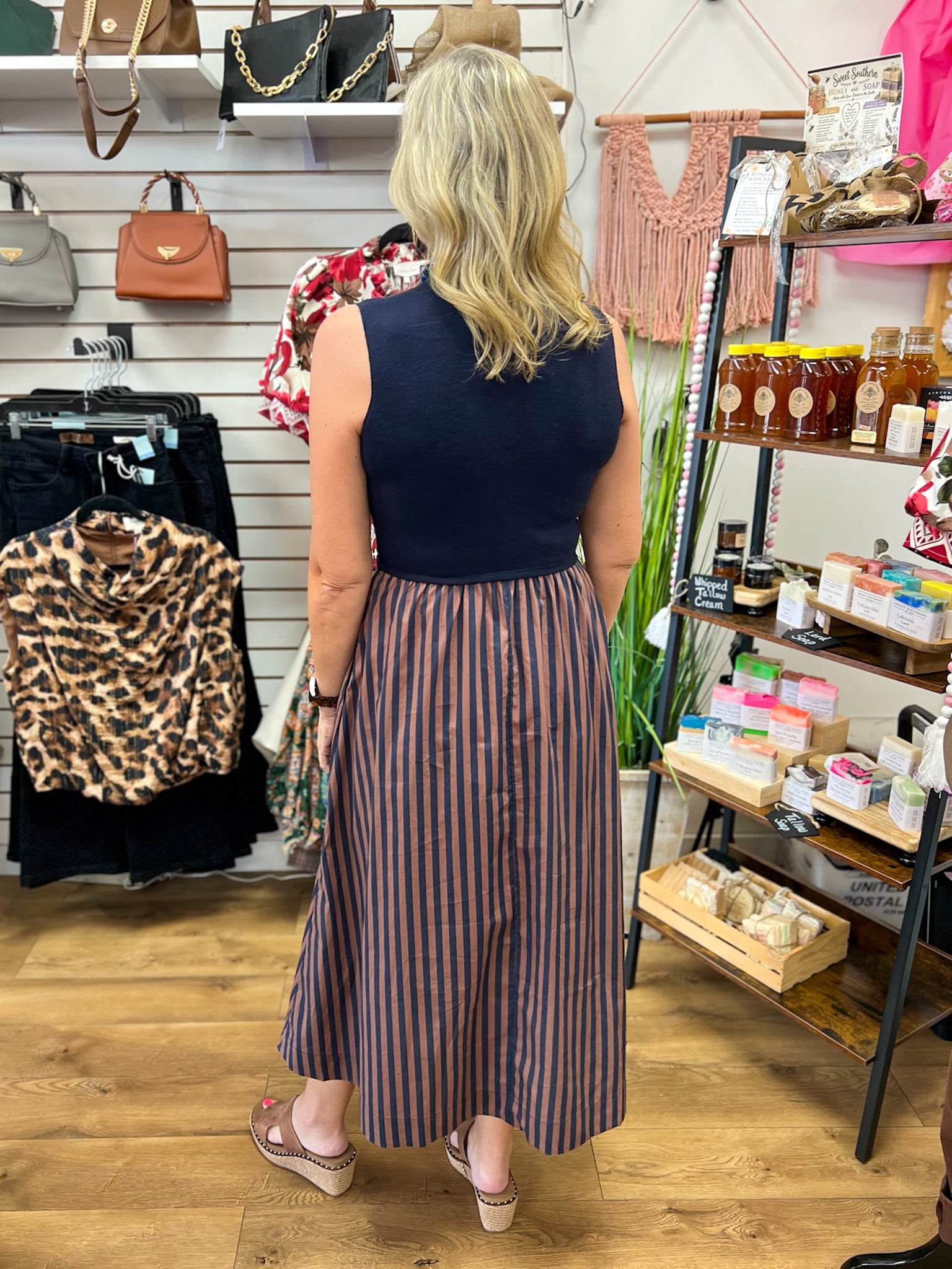Navy sleeveless mock neck midi dress with brown navy vertical striped skirt